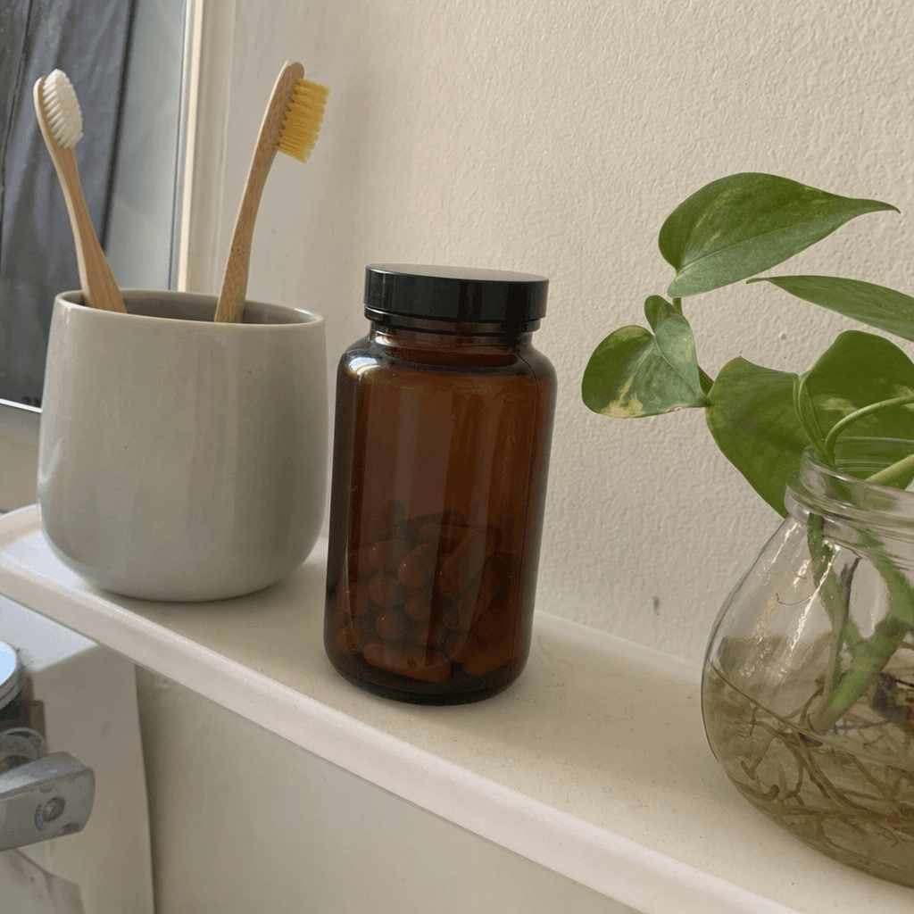 Rooted bottle sitting on a real kitchen shelf next to everyday pantry staples — customer shelfie